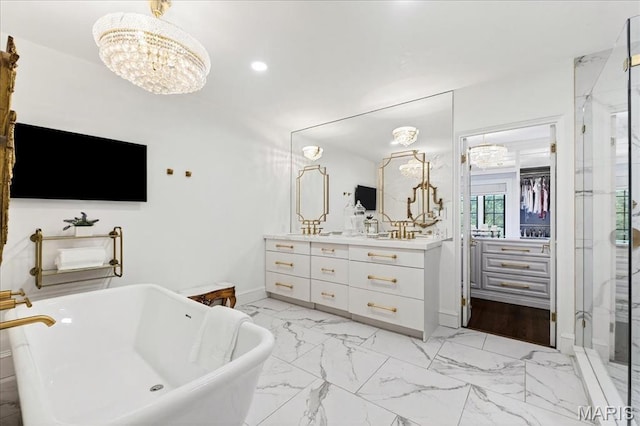 32 Woodoaks Trl, Ladue, MO 63124 - bathroom with a chandelier, vanity, a freestanding bath, a shower stall, and marble look tiles