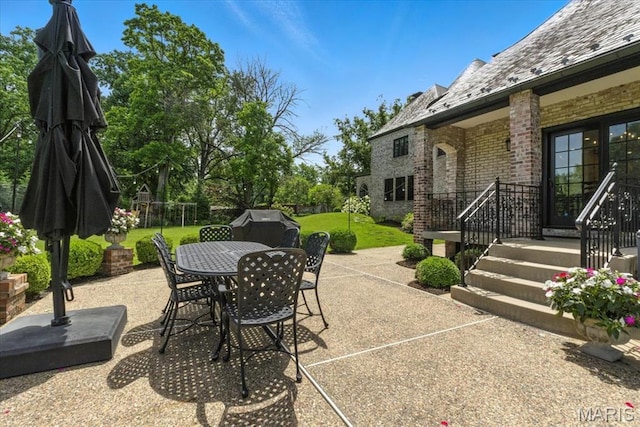 32 Woodoaks Trl, Ladue, MO 63124 - view of patio featuring outdoor dining space and area for grilling