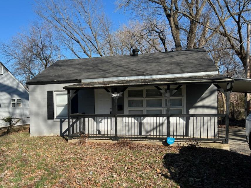 3678 Elsa Ave, Saint Ann, MO 63074 - rear view of house with a porch, concrete block siding, and roof with shingles