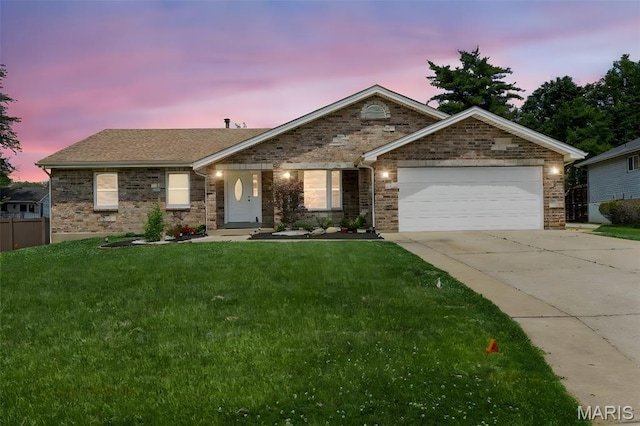4163 Attleboro Ct, Saint Charles, MO 63304 - ranch-style home featuring an attached garage, driveway, a front yard, and brick siding