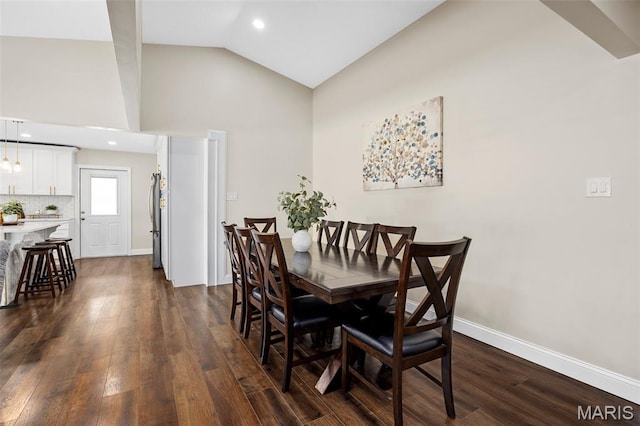 4163 Attleboro Ct, Saint Charles, MO 63304 - dining room featuring dark wood-style flooring, baseboards, recessed lighting, and high vaulted ceiling