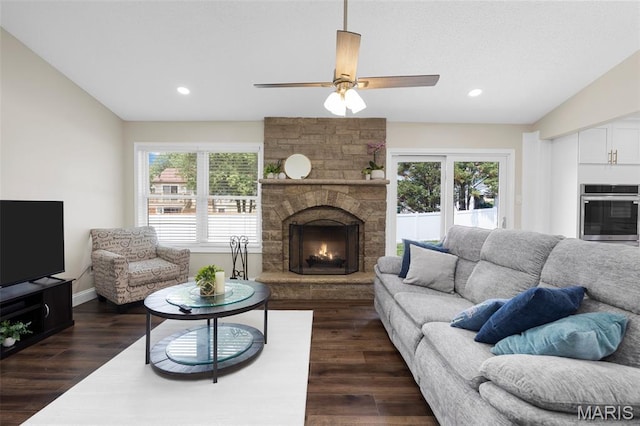 4163 Attleboro Ct, Saint Charles, MO 63304 - living room with a stone fireplace, dark wood-type flooring, a ceiling fan, recessed lighting, and baseboards