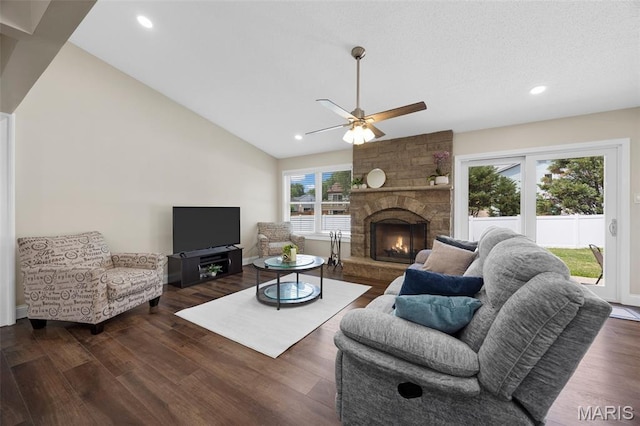 4163 Attleboro Ct, Saint Charles, MO 63304 - living room featuring dark wood-style flooring, ceiling fan, vaulted ceiling, a fireplace, and recessed lighting