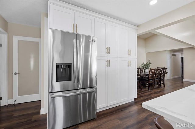 4163 Attleboro Ct, Saint Charles, MO 63304 - kitchen with stainless steel refrigerator with ice dispenser, dark wood-style floors, light stone countertops, white cabinets, and recessed lighting