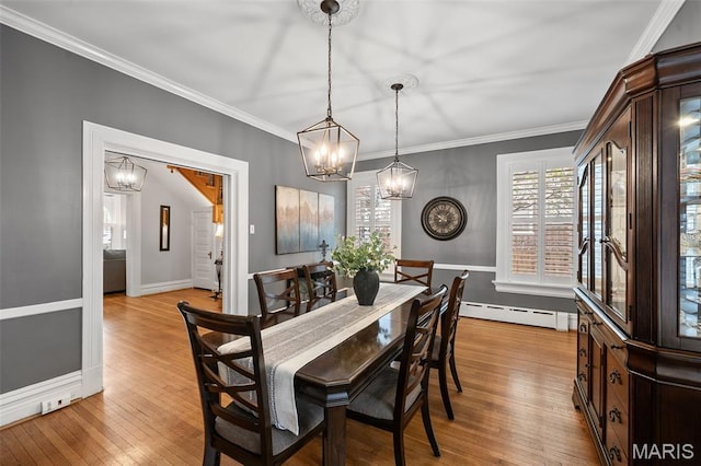 232 N Newstead Ave, Saint Louis, MO 63108 - dining room with baseboard heating, a chandelier, light wood finished floors, plenty of natural light, and crown molding