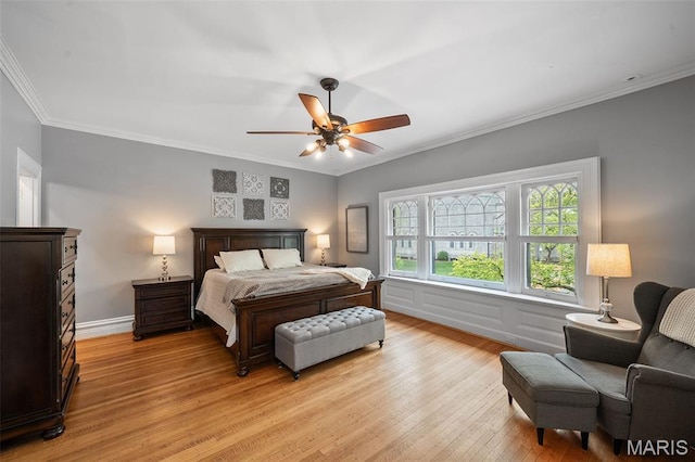 232 N Newstead Ave, Saint Louis, MO 63108 - bedroom with light wood-style flooring, ornamental molding, and ceiling fan