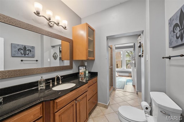 232 N Newstead Ave, Saint Louis, MO 63108 - full bath with tile patterned floors, toilet, a shower stall, vanity, and baseboards