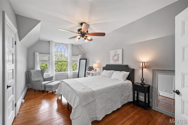 232 N Newstead Ave, Saint Louis, MO 63108 - bedroom featuring dark wood finished floors, vaulted ceiling, baseboards, and a ceiling fan