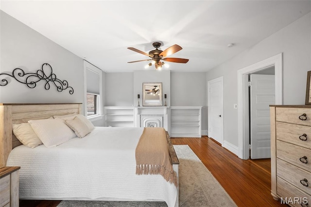 232 N Newstead Ave, Saint Louis, MO 63108 - bedroom featuring dark wood-style flooring, baseboards, and a ceiling fan