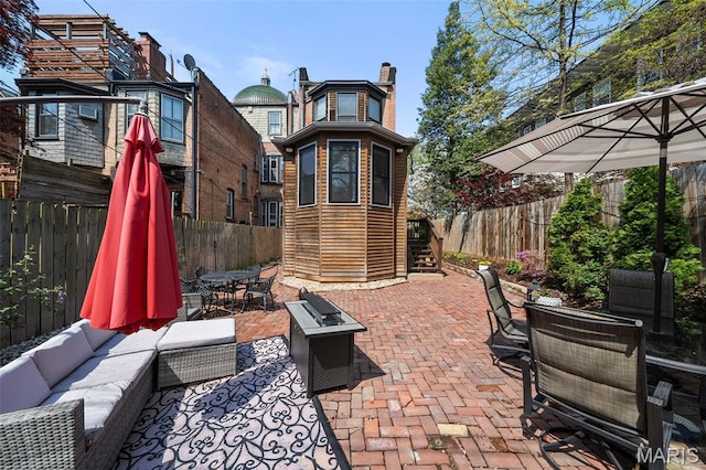232 N Newstead Ave, Saint Louis, MO 63108 - fenced backyard with an outdoor living space, outdoor dining space, and a patio area