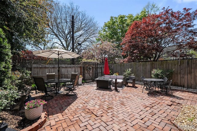232 N Newstead Ave, Saint Louis, MO 63108 - fenced backyard featuring outdoor dining area and a patio