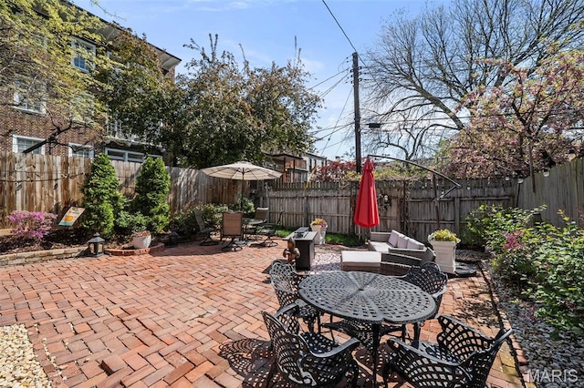 232 N Newstead Ave, Saint Louis, MO 63108 - fenced backyard featuring outdoor dining area and a patio area