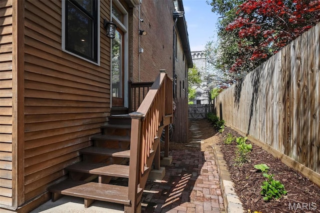232 N Newstead Ave, Saint Louis, MO 63108 - view of property exterior featuring a fenced backyard and a patio area