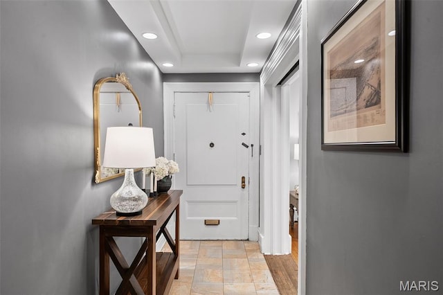 232 N Newstead Ave, Saint Louis, MO 63108 - corridor featuring recessed lighting, light stone finish floors, and a raised ceiling