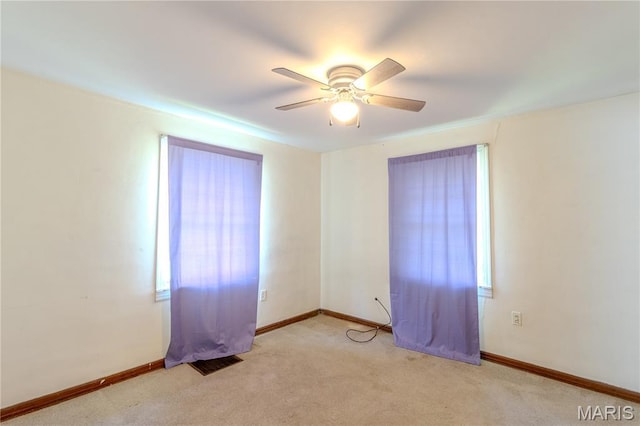 504 N Pine St, Richland, MO 65556 - spare room featuring ceiling fan and light colored carpet