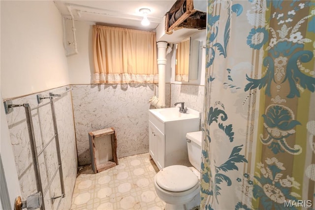 504 N Pine St, Richland, MO 65556 - full bathroom with tile patterned floors, vanity, a wainscoted wall, and a shower with curtain
