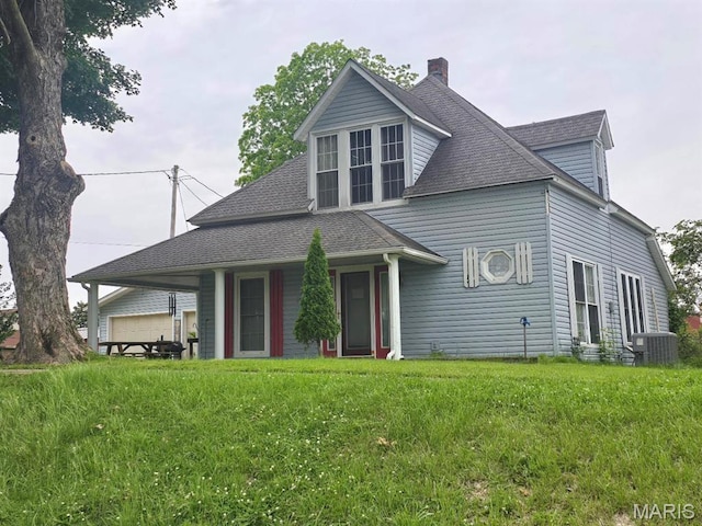 346 S Locust St, Dexter, MO 63841 - view of front facade with a chimney, a shingled roof, central AC, and a front yard