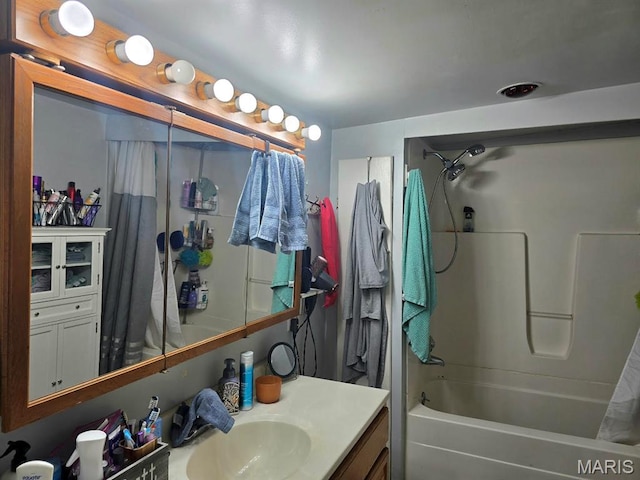 346 S Locust St, Dexter, MO 63841 - bathroom featuring shower / tub combo with curtain and vanity