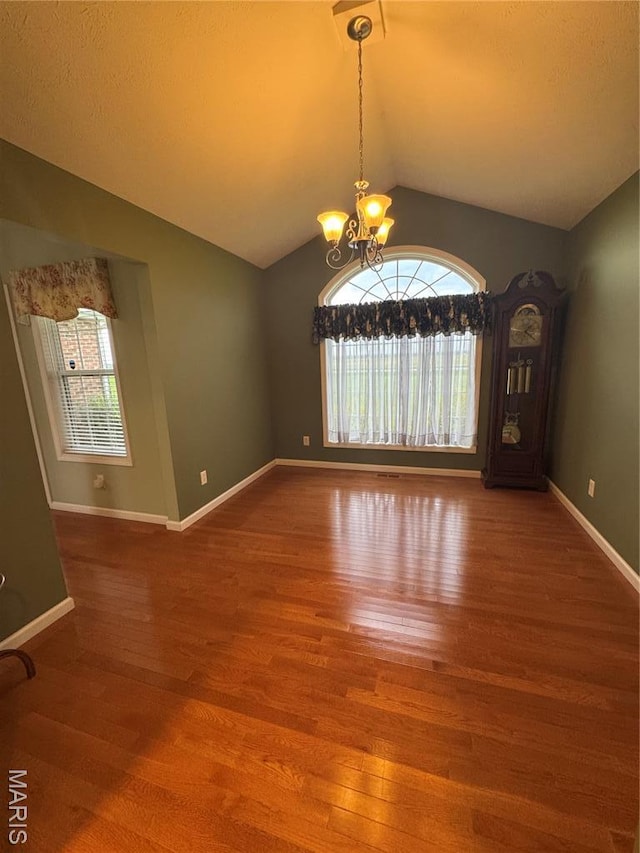 8847 State Route 14th Hwy, Duquoin, IL 62832 - empty room featuring a chandelier, lofted ceiling, wood finished floors, and baseboards