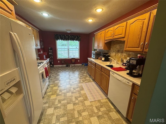 8847 State Route 14th Hwy, Duquoin, IL 62832 - kitchen with white appliances, light countertops, a sink, recessed lighting, and tasteful backsplash