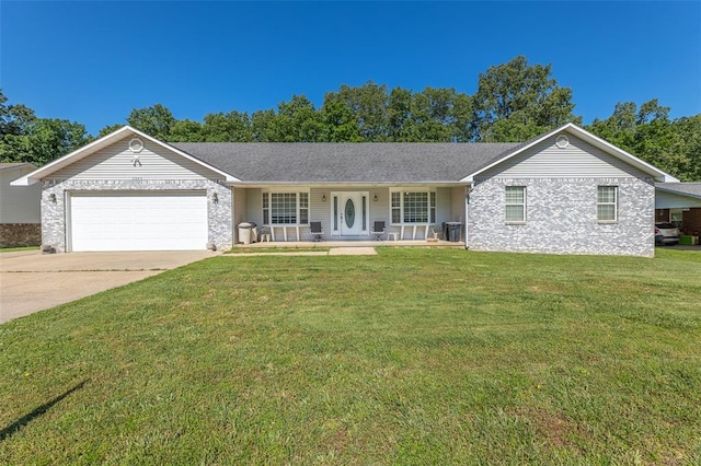 2865 Vaughn Ave, Poplar Bluff, MO 63901 - ranch-style house with an attached garage, covered porch, concrete driveway, and a front lawn