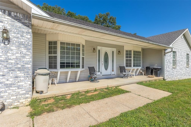 2865 Vaughn Ave, Poplar Bluff, MO 63901 - doorway to property with a porch and roof with shingles