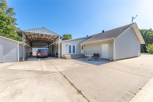 2865 Vaughn Ave, Poplar Bluff, MO 63901 - view of front of property featuring a detached carport, concrete driveway, entry steps, and an outbuilding