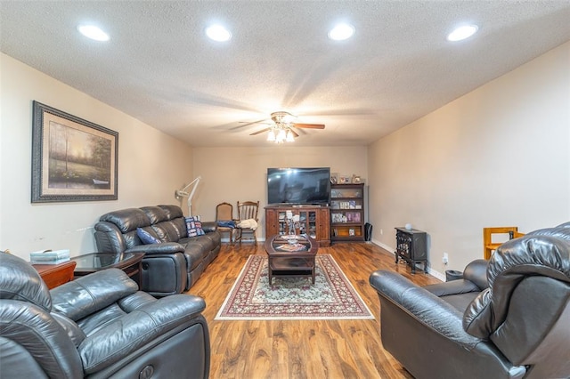 2865 Vaughn Ave, Poplar Bluff, MO 63901 - living room with wood finished floors, a ceiling fan, recessed lighting, baseboards, and a textured ceiling