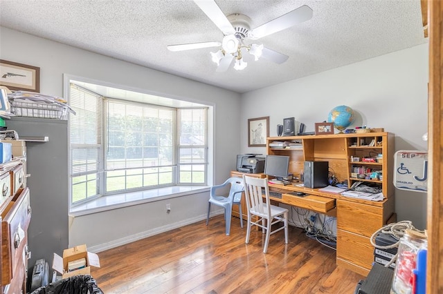2865 Vaughn Ave, Poplar Bluff, MO 63901 - home office featuring plenty of natural light, wood finished floors, a ceiling fan, a textured ceiling, and baseboards