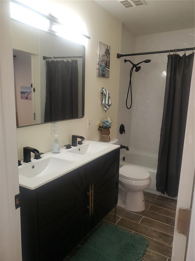 1 Wild Deer Ln, Saint Peters, MO 63376 - bathroom featuring double vanity, wood tiled floors, shower / tub combo, and toilet