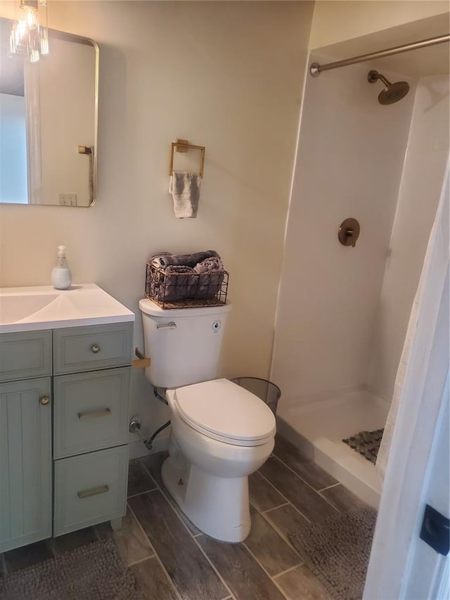 1 Wild Deer Ln, Saint Peters, MO 63376 - full bathroom featuring toilet, vanity, and a stall shower