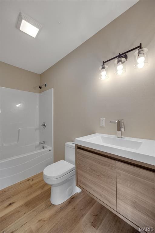 812 Richeson Rd, Potosi, MO 63664 - full bathroom with vanity,  shower combination, and wood finished floors