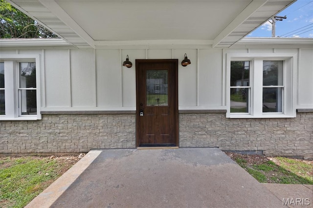 812 Richeson Rd, Potosi, MO 63664 - property entrance featuring stone siding and board and batten siding