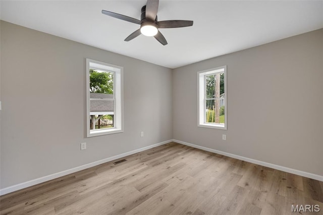 812 Richeson Rd, Potosi, MO 63664 - empty room with plenty of natural light, wood finished floors, and a ceiling fan