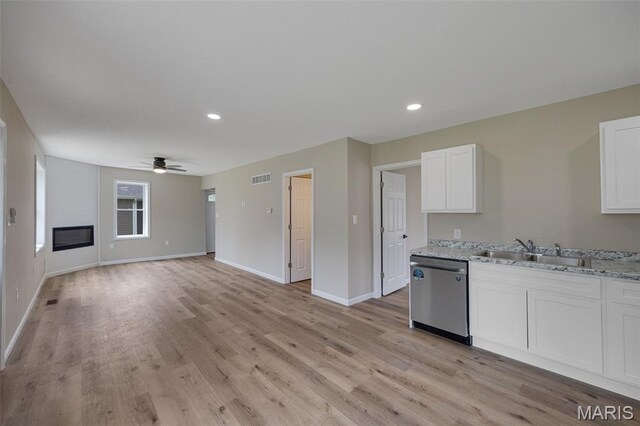 812 Richeson Rd, Potosi, MO 63664 - kitchen featuring stainless steel dishwasher, a ceiling fan, light wood-style floors, white cabinets, and light stone countertops