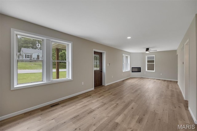 812 Richeson Rd, Potosi, MO 63664 - unfurnished living room featuring plenty of natural light, a ceiling fan, light wood-style floors, and recessed lighting