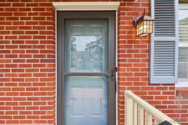 8854 Flamingo Ct, Saint Louis, MO 63144 - entrance to property with brick siding