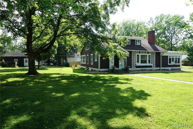 301 S Meramec St, St James, MO 65559 - view of front of home with a chimney and a front yard