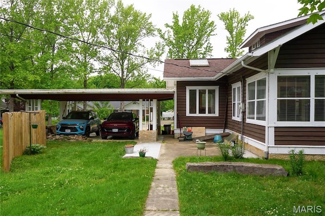 301 S Meramec St, St James, MO 65559 - view of green lawn with a detached carport