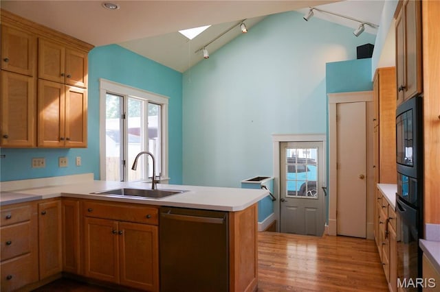 301 S Meramec St, St James, MO 65559 - kitchen featuring stainless steel dishwasher, rail lighting, a peninsula, a skylight, and black microwave