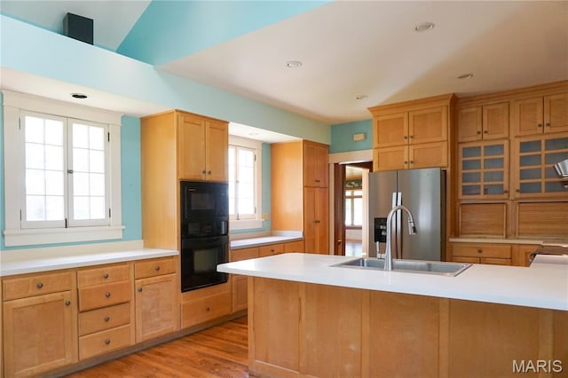 301 S Meramec St, St James, MO 65559 - kitchen with black appliances, light countertops, light wood finished floors, recessed lighting, and light brown cabinets