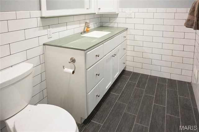 301 S Meramec St, St James, MO 65559 - bathroom featuring tile walls and vanity