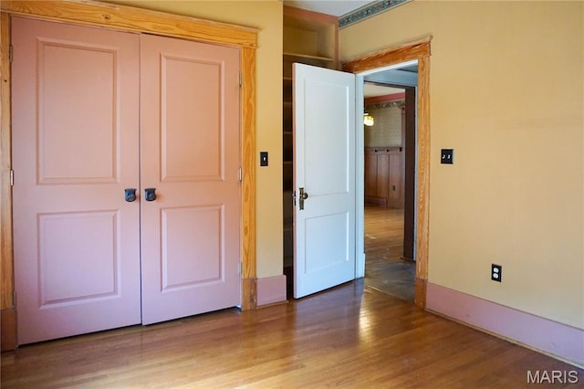 301 S Meramec St, St James, MO 65559 - unfurnished bedroom with a closet and wood finished floors