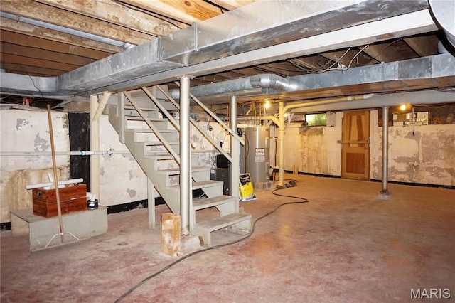 301 S Meramec St, St James, MO 65559 - unfinished below grade area with electric water heater and stairway