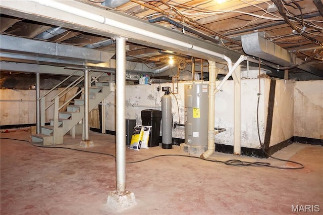 301 S Meramec St, St James, MO 65559 - unfinished below grade area featuring water heater, stairway, and a water softener