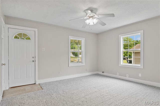233 Oconnell St, Cape Girardeau, MO 63701 - carpeted entrance foyer with a ceiling fan, a textured ceiling, ornamental molding, and baseboards