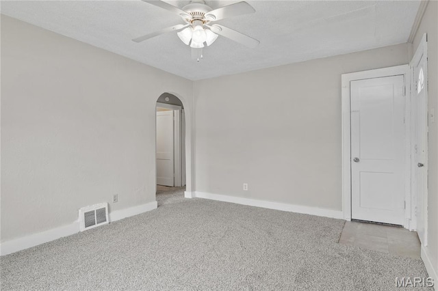 233 Oconnell St, Cape Girardeau, MO 63701 - spare room with light carpet, arched walkways, ceiling fan, and baseboards