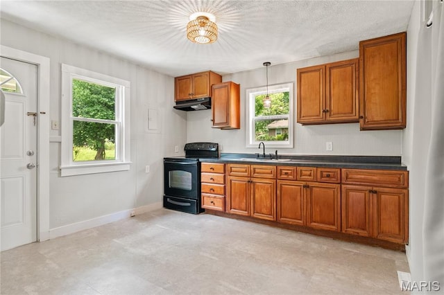 233 Oconnell St, Cape Girardeau, MO 63701 - kitchen with black range with electric cooktop, under cabinet range hood, brown cabinetry, dark countertops, and a sink