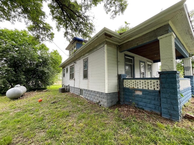 20621 County Highway 22, Hoyleton, IL 62803 - view of side of home featuring cooling unit, covered porch, and a yard