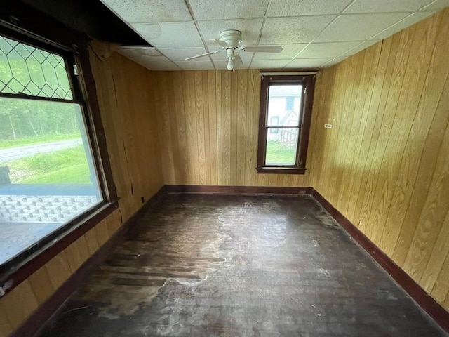 20621 County Highway 22, Hoyleton, IL 62803 - empty room with wooden walls, baseboards, and a ceiling fan